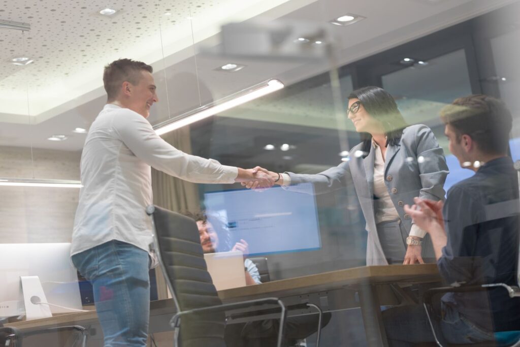 image of a client shaking hands with a digital marketing agency owner