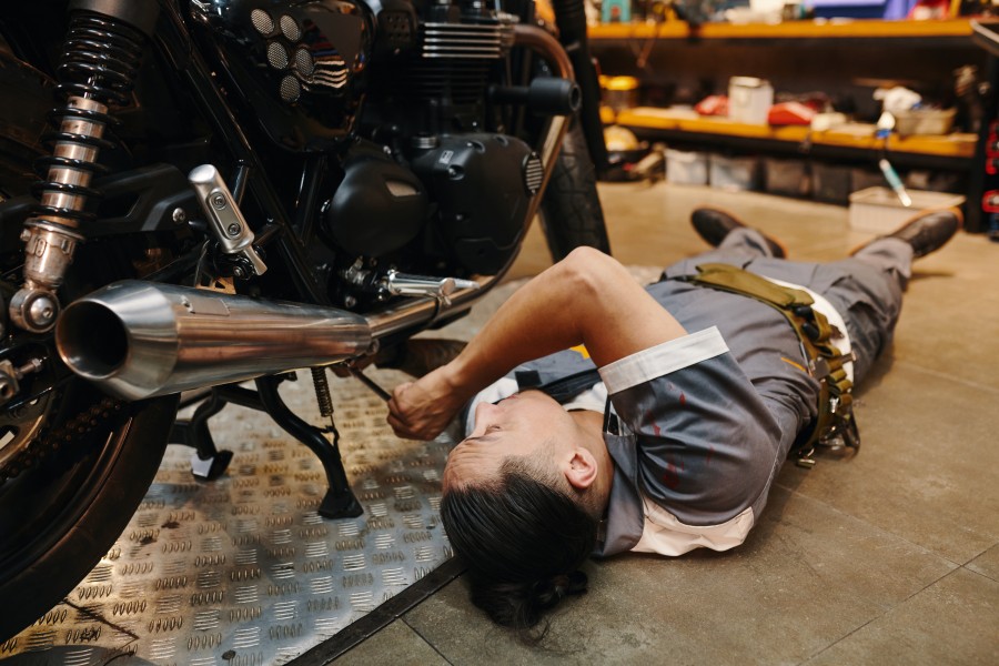 Image of a person doing maintenance on his bike
