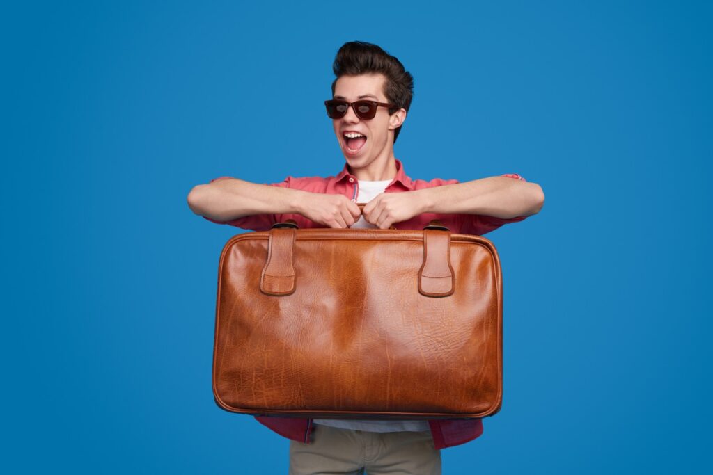 Image Of A Person Checking The Weight Of His Bag