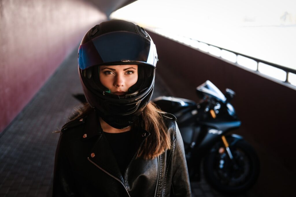 Image of a biker with her bike